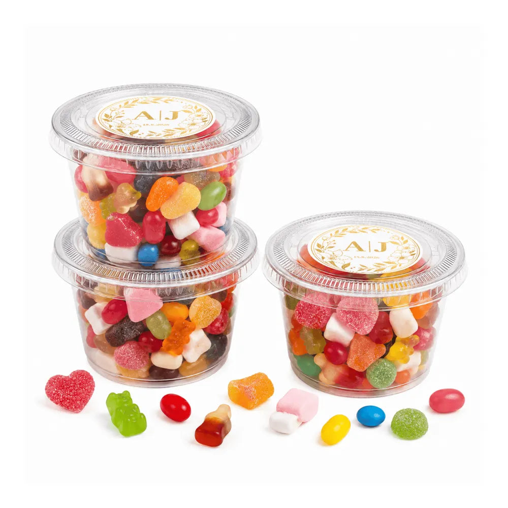 Clear plastic tubs filled with colorful gummy candies and jelly beans labeled monogram wreath foiled sticker sweet tub 80g