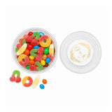 Clear glass jar with gold embossed monogram wreath foiled lid filled with colorful gummy candies for wedding tub