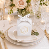 White paper favour box with gold embossed g and m monogram butterfly cutout perfect for monogram wreath wedding favours
