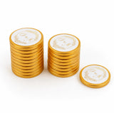 Golden 40mm milk chocolate coins with white centers featuring gold embossed g and m monograms for wedding favours