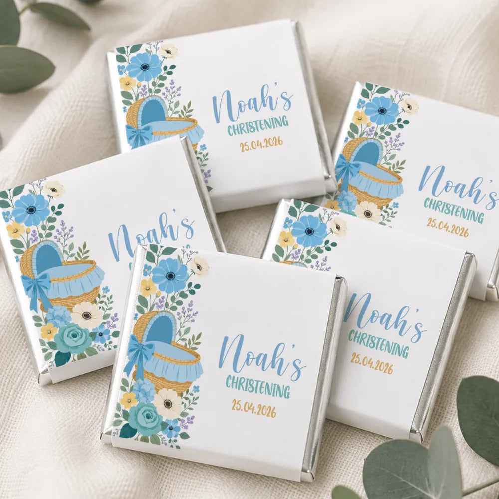 White chocolate mini neapolitan chocolates with blue floral and moses basket designs for noah’s christening april 25 2026