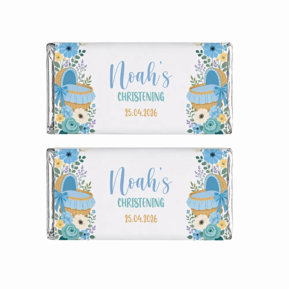 Two personalized 40g blue moses basket chocolate bars wrapped in silver foil with floral baby basket design for christening