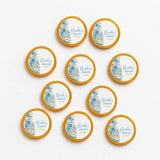Blue and white personalised chocolate coins with moses basket pram design and gold foil edges for christening gifts