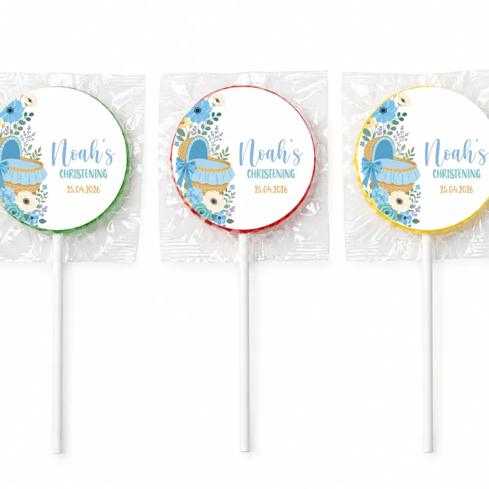 Three blue moses basket personalized lollipop favours with floral design and baby carriage wrapped in clear cellophane