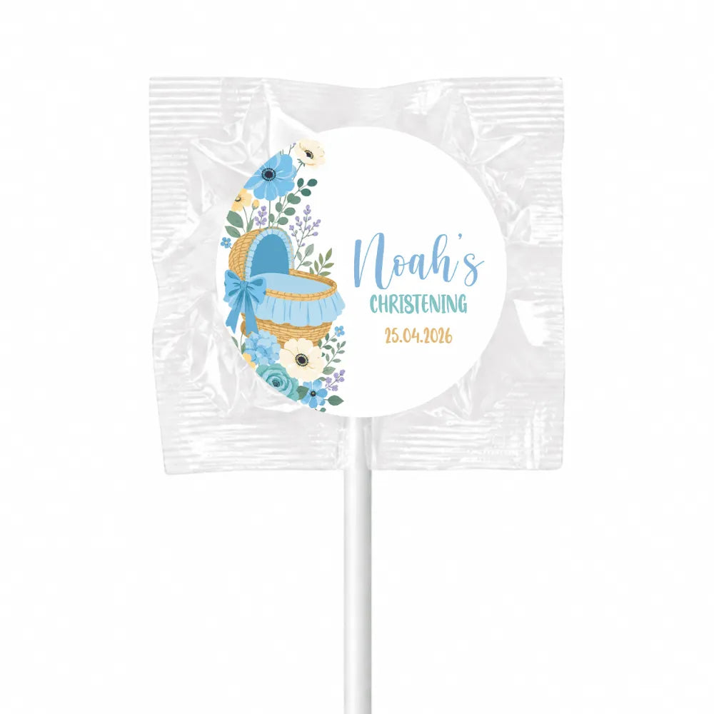Personalised blue moses basket floral lollipop favours wrapped in clear foil for christening celebrations