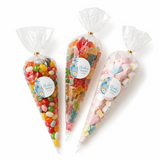Three clear plastic sweet cones sealed with gold bands and blue moses basket labels for noahs first birthday