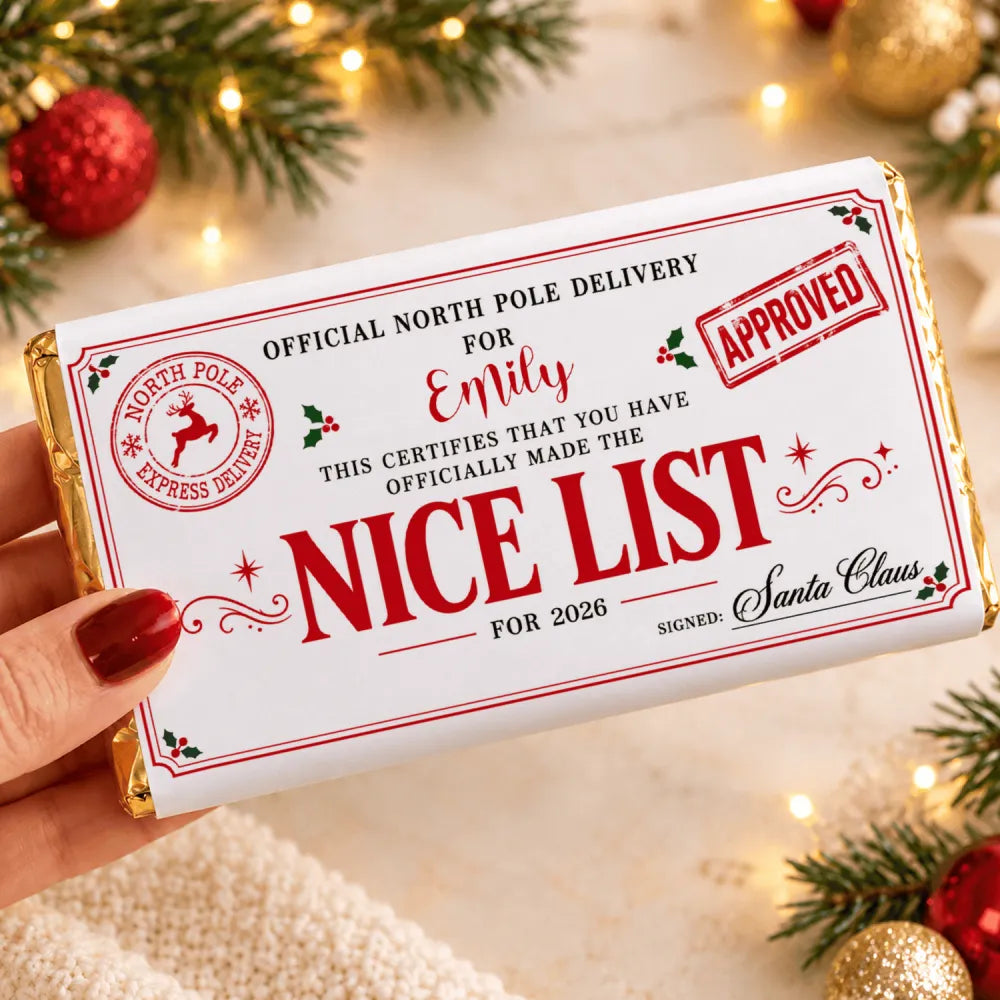 A 135g white chocolate bar wrapped in festive red and gold foil with a nice list design for emily 2026