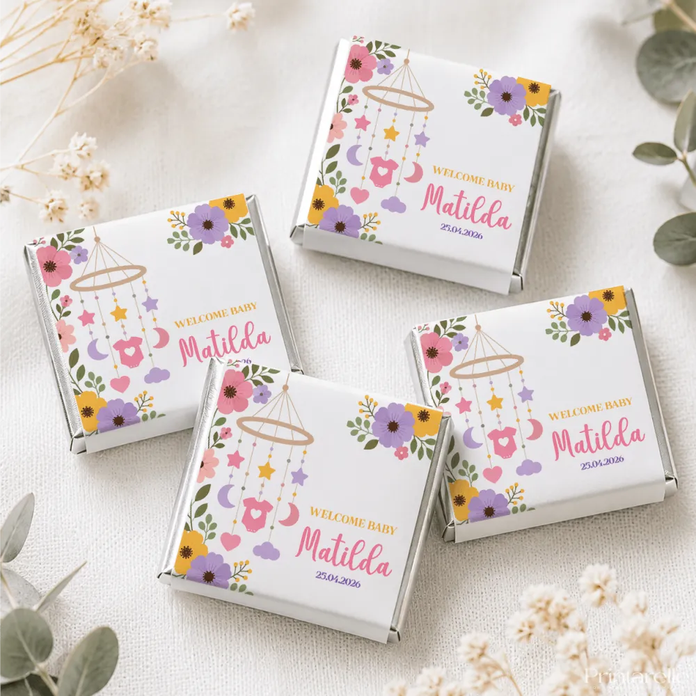 White chocolate mini neapolitan chocolates in nursery mobile gift boxes with colorful floral and welcome baby matilda design