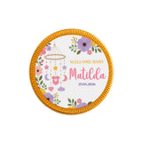 A round gold-edged milk chocolate coin with floral baby design personalized with name matilda and date for nursery mobile