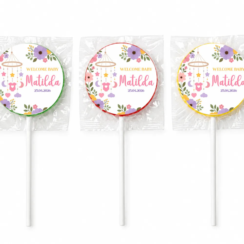 Three swirl lollipops with colorful floral design and welcome baby matilda label for nursery mobile lollipop favours