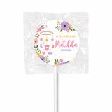 A sweet round swirl lollipop favour wrapped in clear plastic with colorful welcome baby matilda nursery mobile design