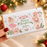 A personalized white chocolate bar wrapped in gold foil with a soldier nutcracker festive merry christmas design