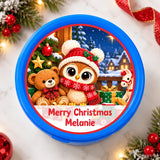 Blue circular christmas teddy tub sticker featuring a woolly owl in red hat and scarf with teddy bear and snowy village