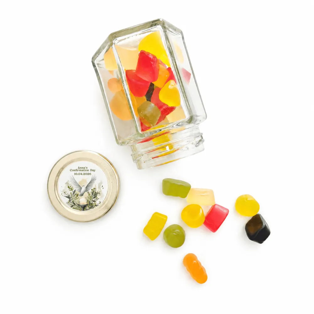 Clear glass hexagonal jar with 48mm pale gold twist lid engraved with watercolour dove and laurel filled with gummies