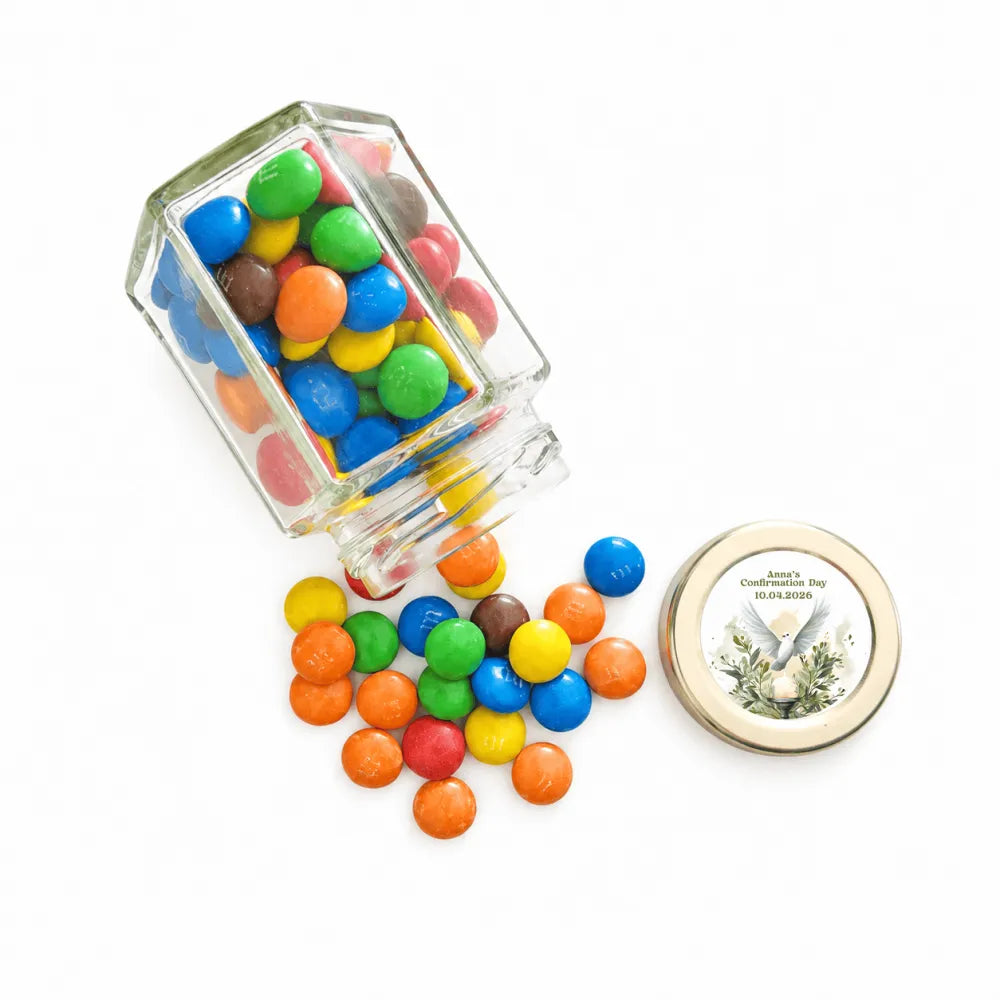 Hexagonal clear glass jar filled with colorful m and ms candies for peaceful dove confirmation with pale gold twist lid