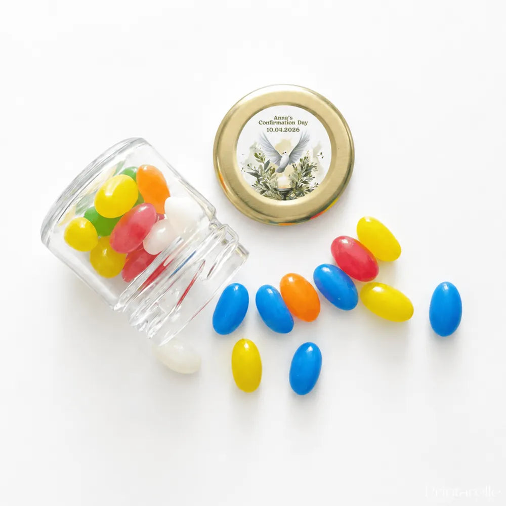 Clear glass mini jar with pale gold twist lid spilling colorful jelly beans from peaceful dove confirmation set