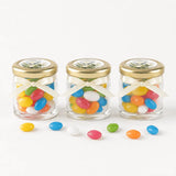 Three personalised mini jars filled with colorful jelly beans with pale gold twist lids and cream ribbons for peaceful dove confirmation