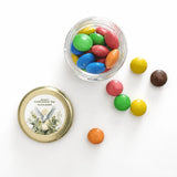 A clear glass mini jar with a 43mm pale gold twist lid and a watercolour dove label for peaceful dove confirmation