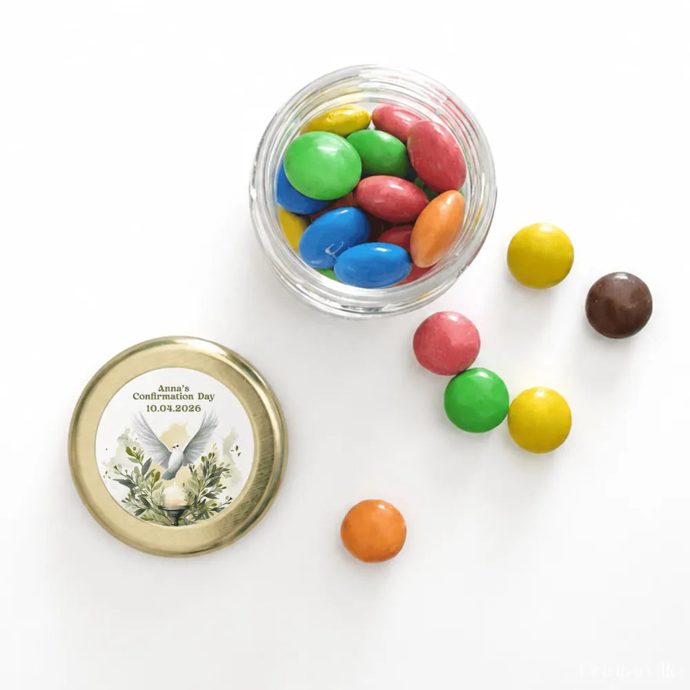 A clear glass mini jar with a 43mm pale gold twist lid and a watercolour dove label for peaceful dove confirmation