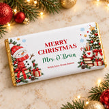 A festive white chocolate bar wrapper with gold foil edges and a cheerful snowman for pencil pot teacher thank you gift