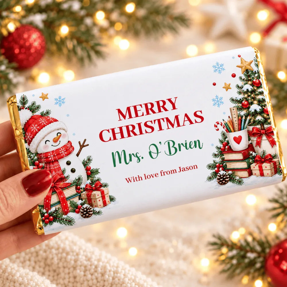 A festive white milk chocolate wrap with cocoa butter featuring a snowman christmas tree and personalized names for pencil pot gifts
