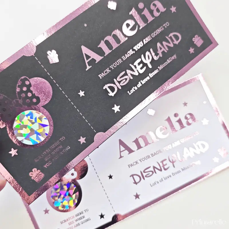 Two Disneyland-themed scratch-off tickets with decorative elements on a white background