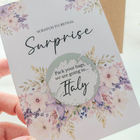 Personalised scratch-to-reveal surprise card with floral design and hidden message for travel, pregnancy, or proposal.