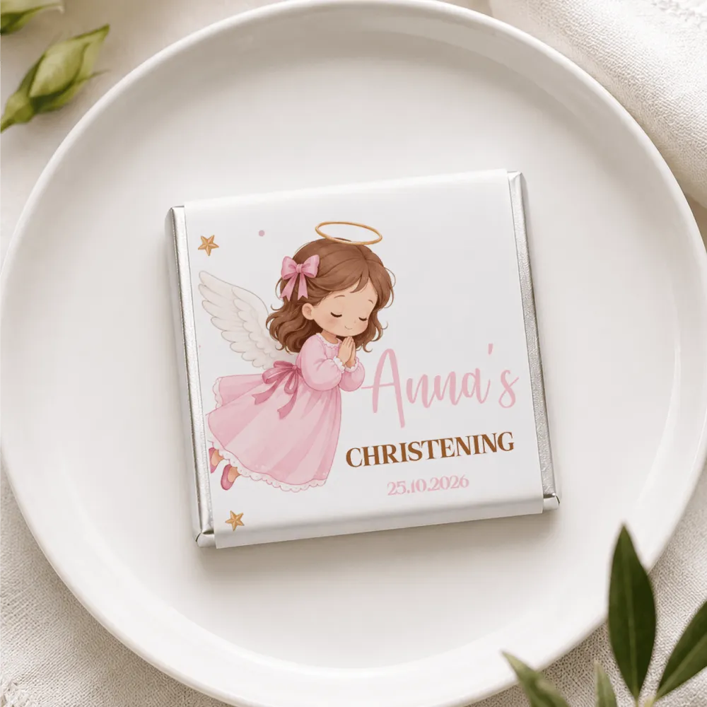 A white chocolate mini neapolitan with a silver foil wrapper featuring a pink angel illustration from pink angel christening