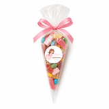 A pink angel christening sweet cone filled with colorful gummies and tied with a pink satin bow