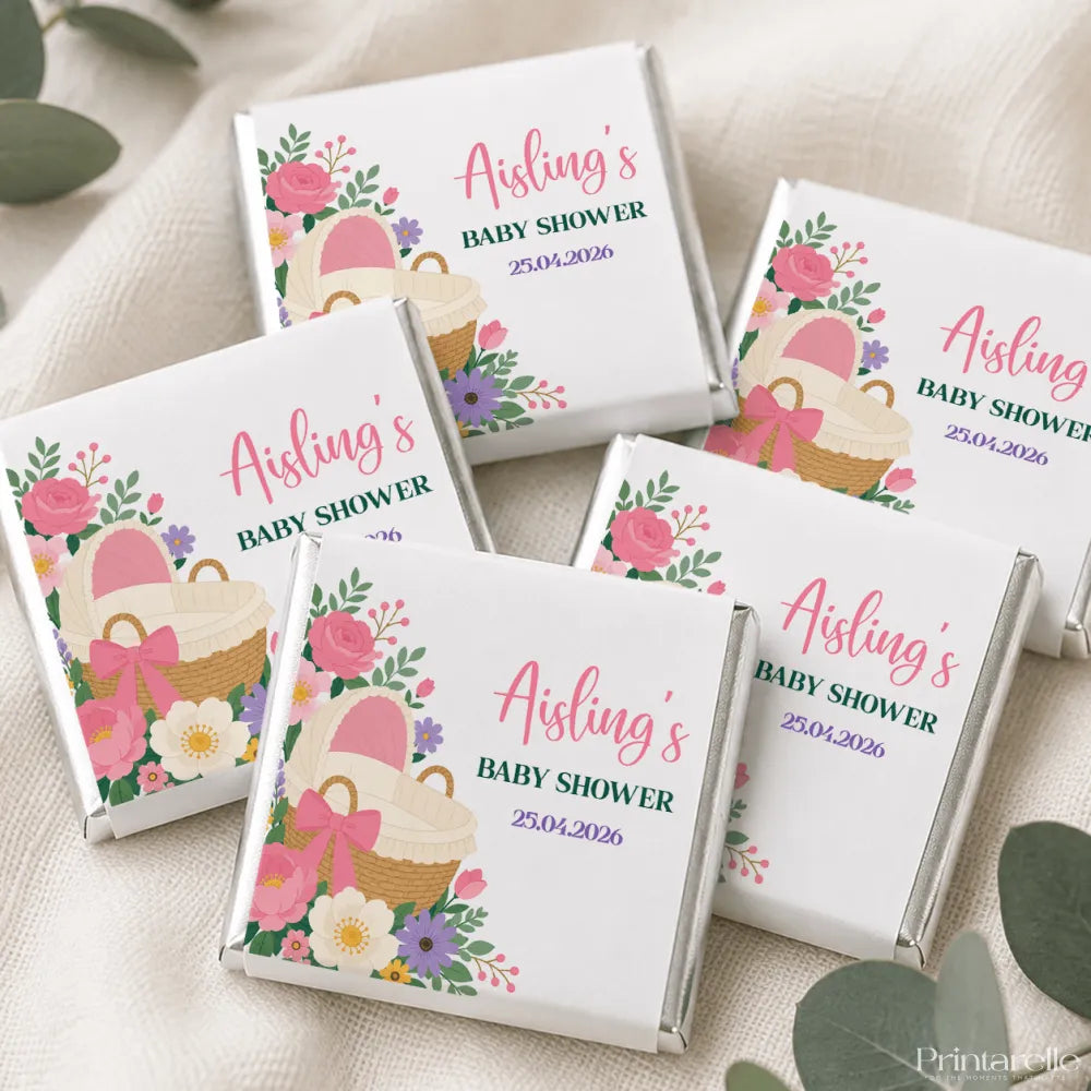 White chocolate mini neapolitan chocolates with pink and purple floral wrapper personalized for aisling’s baby shower