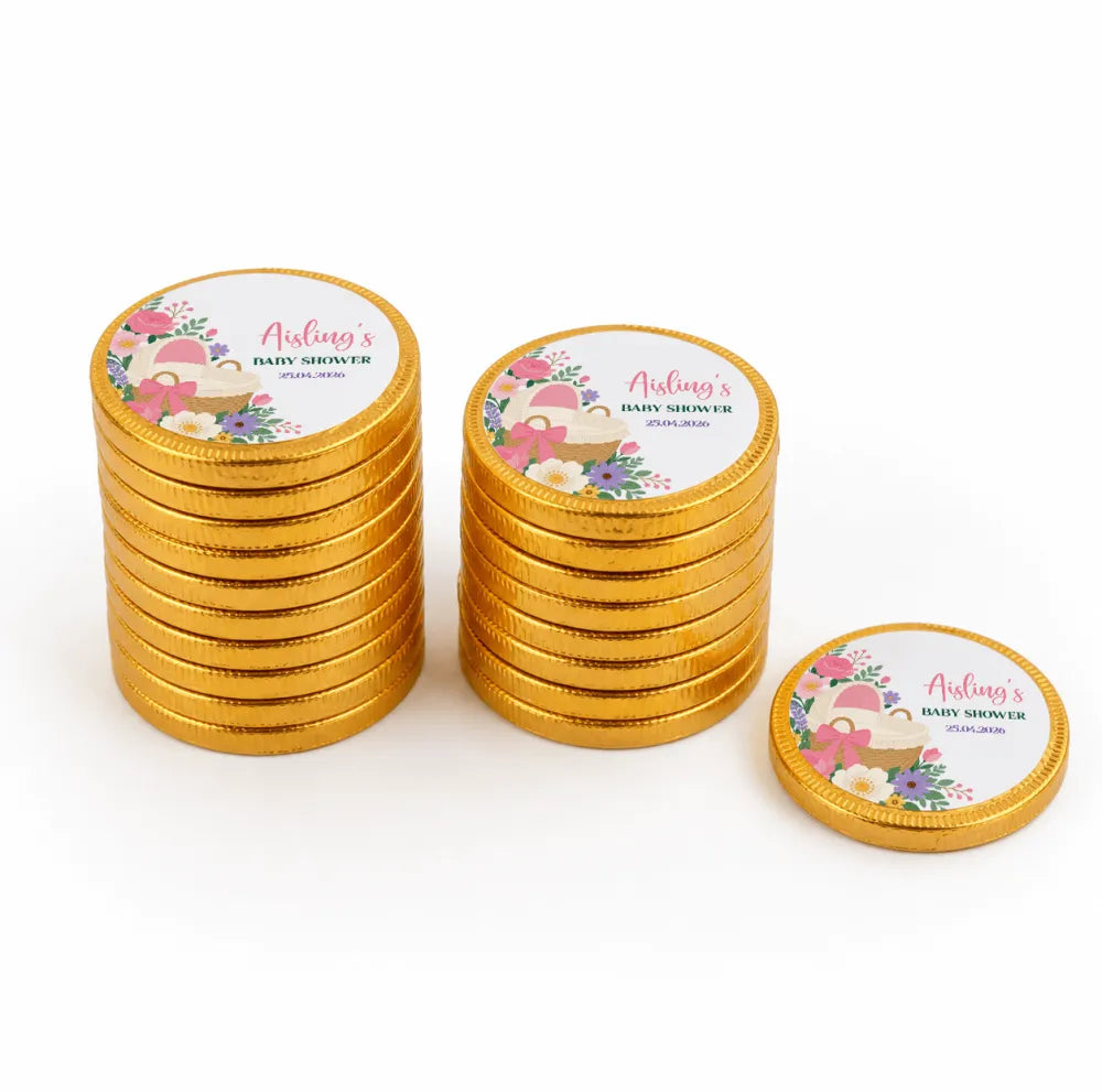 Golden chocolate coins with floral and baby shower labels for pink bassinet personalised chocolate coins