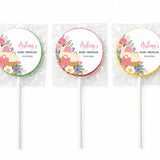 Three personalized pink bassinet baby shower swirl lollipops finished with floral cupcake basket design wrapped in cellophane