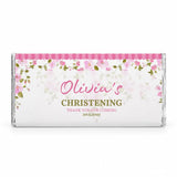A personalised 40g pink blossom chocolate bar with a pink and green floral wrapper for olivias christening
