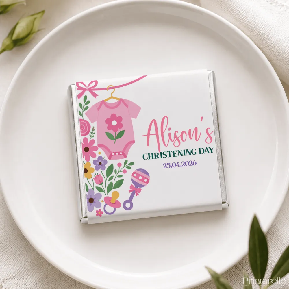 A personalized white chocolate bar with a pink babygrow and floral design for alisons christening day mini neapolitan chocolates
