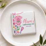 A personalized white chocolate bar with a pink babygrow and floral design for alisons christening day mini neapolitan chocolates