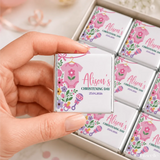Pink floral themed mini neapolitan chocolates with personalized alisons christening day label and pink babygrow design