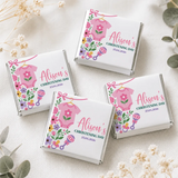 Pink onesie christening mini neapolitan chocolates in white wrappers with floral and baby accessory pink babygrow designs