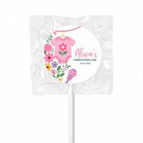 Pink floral-themed swirl lollipops finished with personalised label for alison’s christening day pink babygrow favor