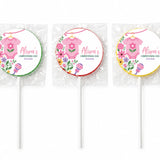 Three personalized pink babygrow lollipop favours wrapped in clear cellophane with colorful floral swirl lollipops finished