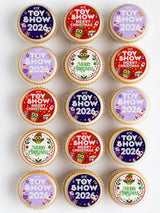 Round festive cupcakes with merry christmas cupcake toppers in red purple and white icing sheet designs