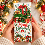 A festive white 100g chocolate bar wrapped in holiday-themed paper with red green and gold gift box designs and bow