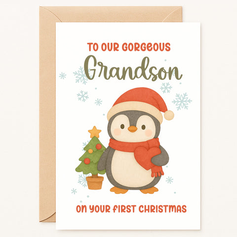 Christmas card with a penguin holding a small Christmas tree, addressed to a grandson.