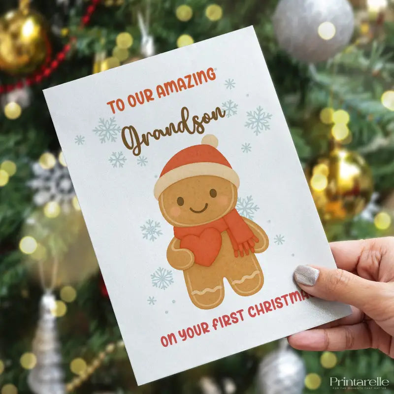 Greeting card with gingerbread man illustration and text in front of a decorated Christmas tree.