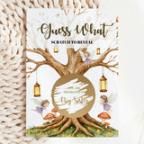 Card with fairy design and text 'Guess What Scratch to Reveal' on a textured surface