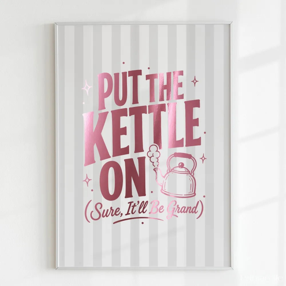 Framed print with pink text 'Put the Kettle On (Sure, It'll Be Grand)' on a striped background