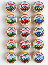 Birthday-themed edible cupcake toppers featuring colorful racing car designs with happy birthday text and road scenes