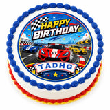 Round birthday cake with racing cars cake topper featuring colorful sports cars on an icing sheet track design