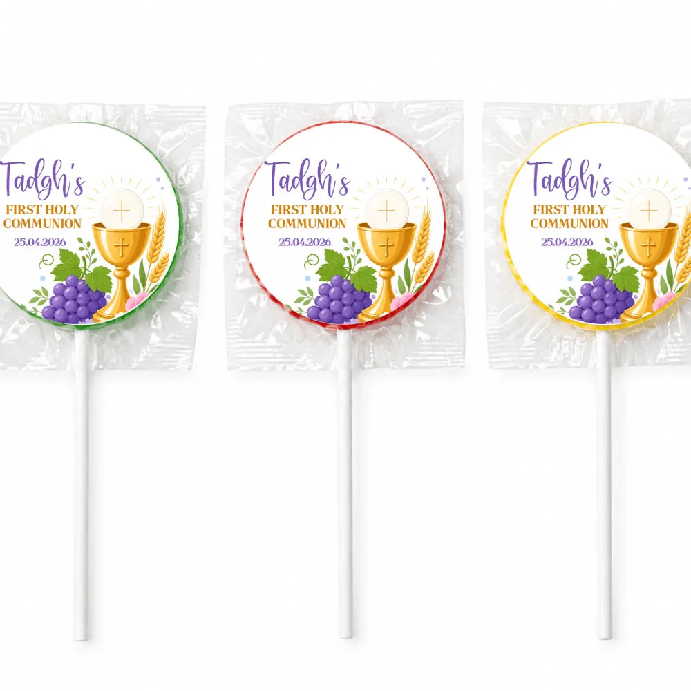 Three wrapped fruit lollipops with colorful foil featuring a gold chalice purple grapes and personalised first holy communion text