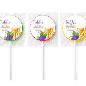 Three wrapped fruit lollipops with colorful foil featuring a gold chalice purple grapes and personalised first holy communion text