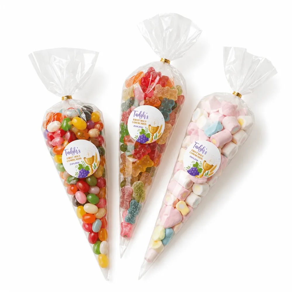 Three clear plastic sweet cones filled with colorful candies sealed with gold ties featuring communion labels in three sizes